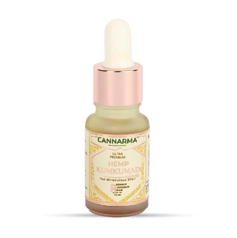A brown glass bottle of Cannarma Hemp Kumkumadi Face Oil with a white dropper cap.