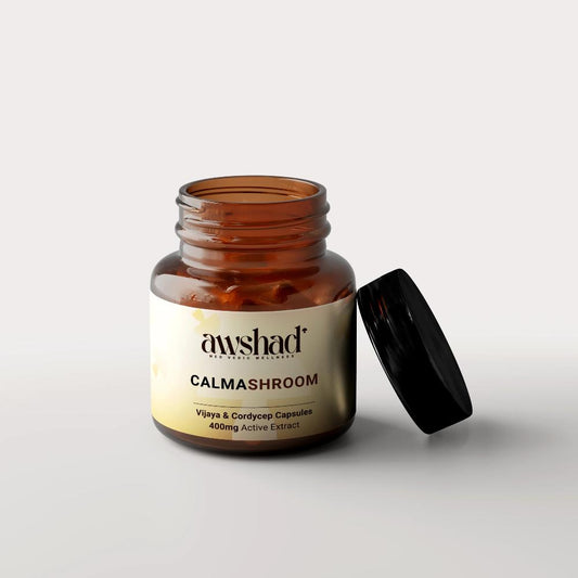 a jar of calmashroom vijaya extract and cordiceps pills sitting on top of a table