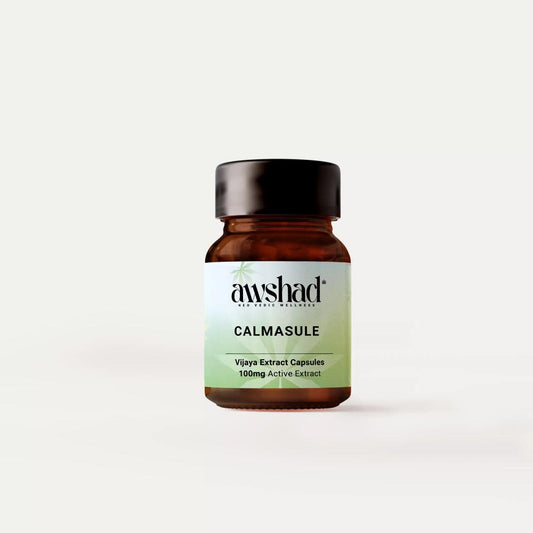 Amber glass bottle with label "CALMASULE Vijaya Extract Capsules" against a white background.