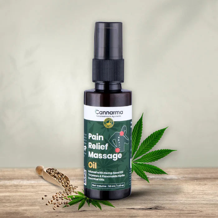 Brown bottle of Cannarma Pain Relief Massage Oil with cannabis leaves and hemp seeds.