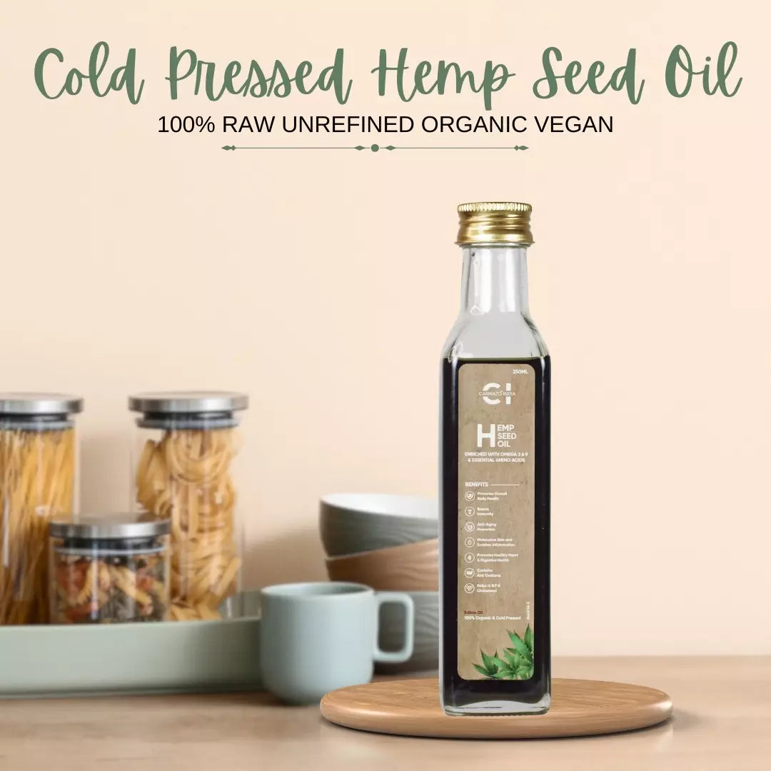 A bottle of cold-pressed cannazo hemp seed oil on a wooden round board with kitchen backdrop.