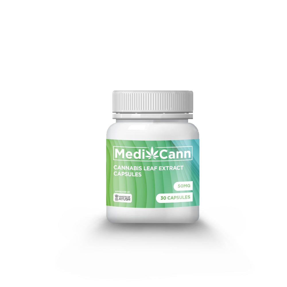 White pill bottle with a green and blue MediCann Cannabis leaf extract lable.