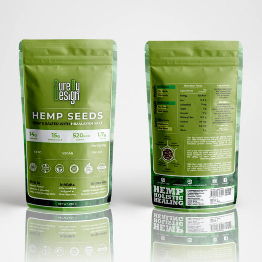 Two green packages of Cure by Design Hemp Seeds on a reflective surface with a white background