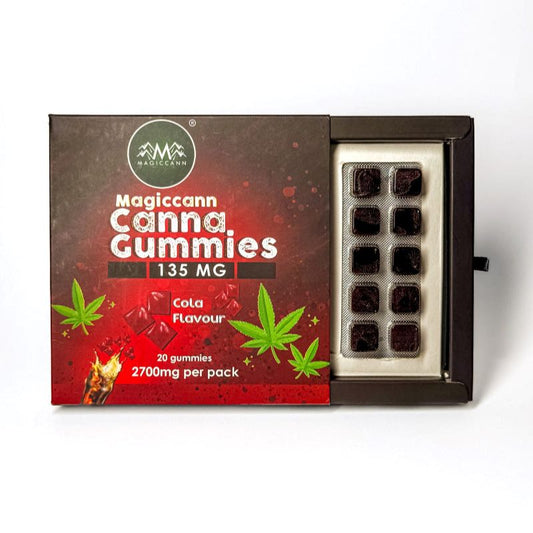 A box of Magiccann Canna Gummies, cola flavor, with visible cannabis gummies in a tray.