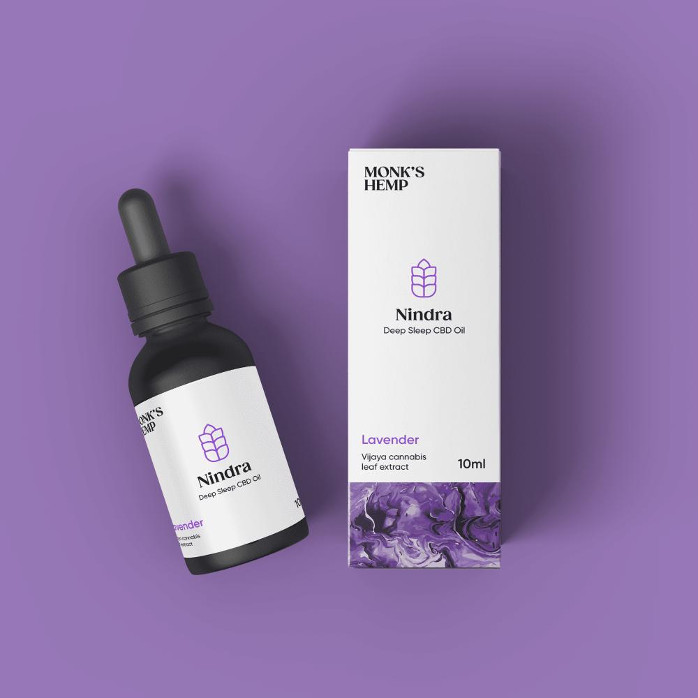 "Monk's Hemp Nindra Deep Sleep CBD Oil bottle and box on a purple background."
