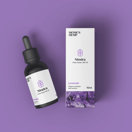 "Monk's Hemp Nindra Deep Sleep CBD Oil bottle and box on a purple background."