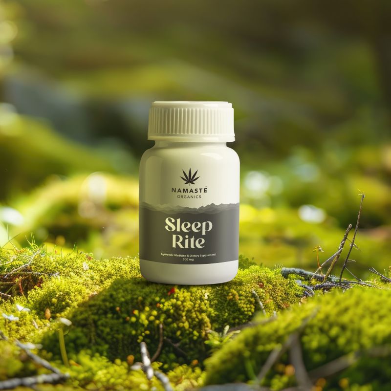 Bottle of Namaste Organics Sleep Rite Full spectrum CBD Oil tablet on a mossy surface with a blurred green natural background