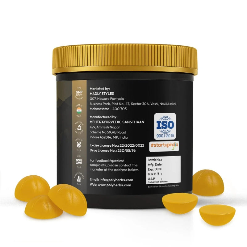 Black container with gold lid and yellow capsules on a white background