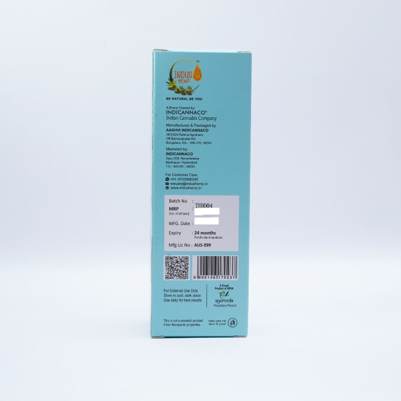 Back view of a blue box with text and a barcode on a light gray background