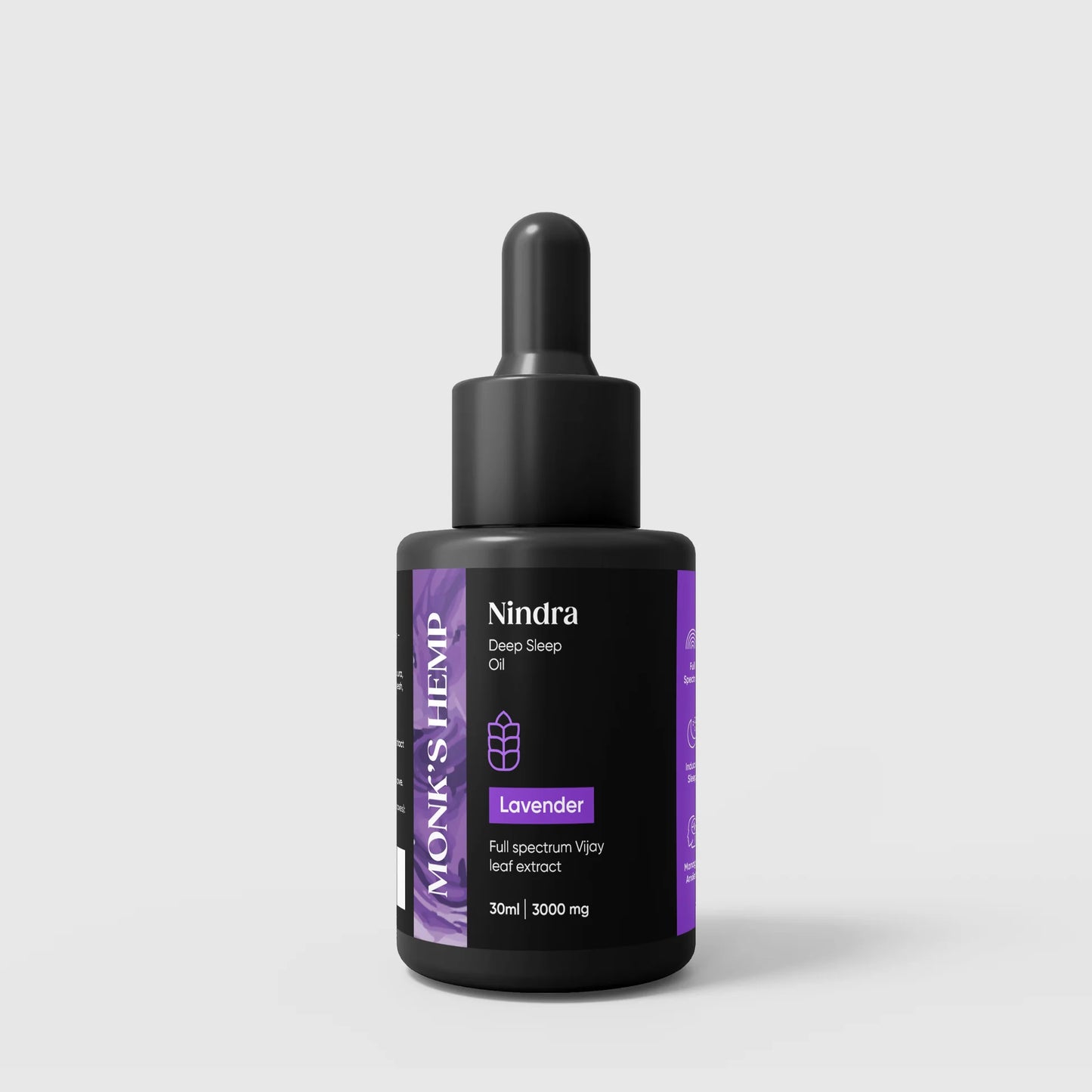 Bottle of Nindra lavender oil with a black dropper on a light gray background