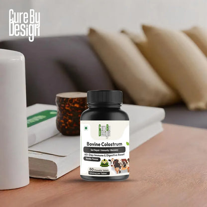 Bovine Colostrum supplement bottle on a wooden surface with a blurred background