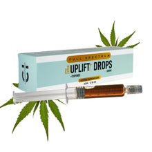 Load image into Gallery viewer, Product packaging for &quot;Cannazo Uplift Drops&quot; with a syringe containing a brown liquid, placed beside cannabis leaves.
