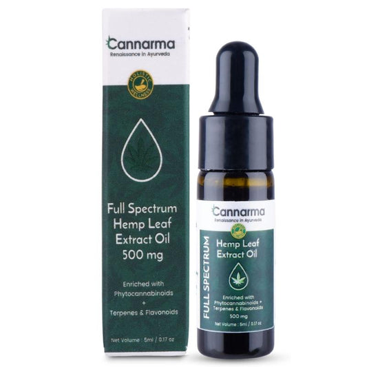 A brown glass bottle with a black dropper cap labeled "Cannarma Hemp Leaf Extract Oil" containing 500mg of phytocannabinoids.