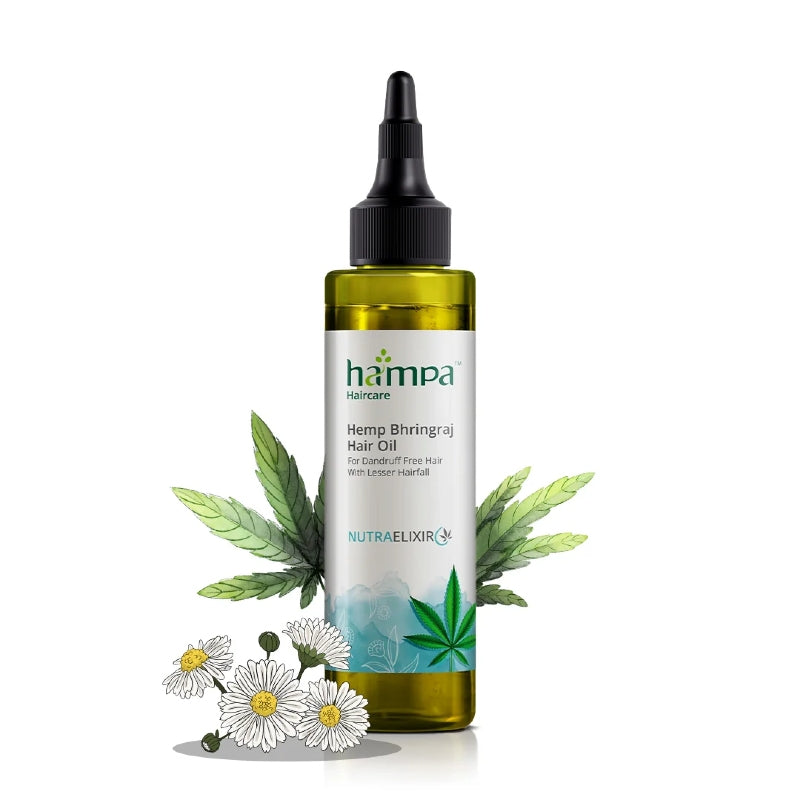 Hemp Bhringraj Hair Oil bottle with leaves and flowers on a white background