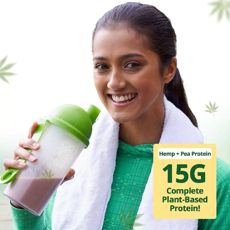 Woman holding a protein shake with a label indicating 15G of complete plant-based protein.