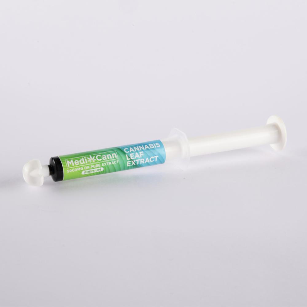 Syringe-like container labeled "MediCann 5000MG OF PURE EXTRACT PREMIUM" and "CANNABIS LEAF EXTRACT."