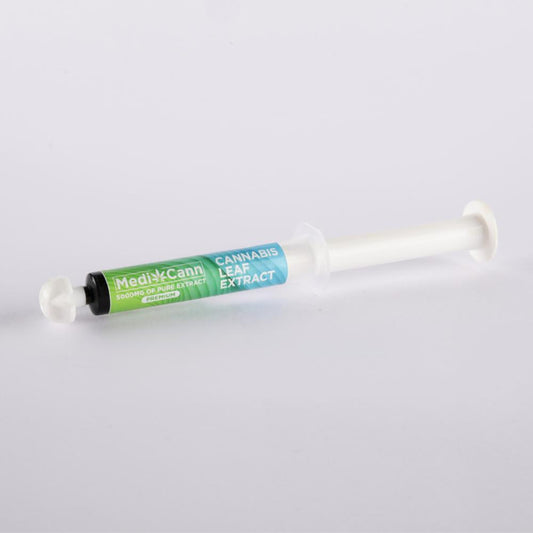 Syringe-like container labeled "MediCann 5000MG OF PURE EXTRACT PREMIUM" and "CANNABIS LEAF EXTRACT."