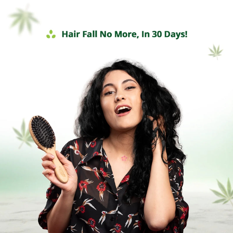 Woman holding a hairbrush with text 'Hair Fall No More, In 30 Days!' on a light green background.