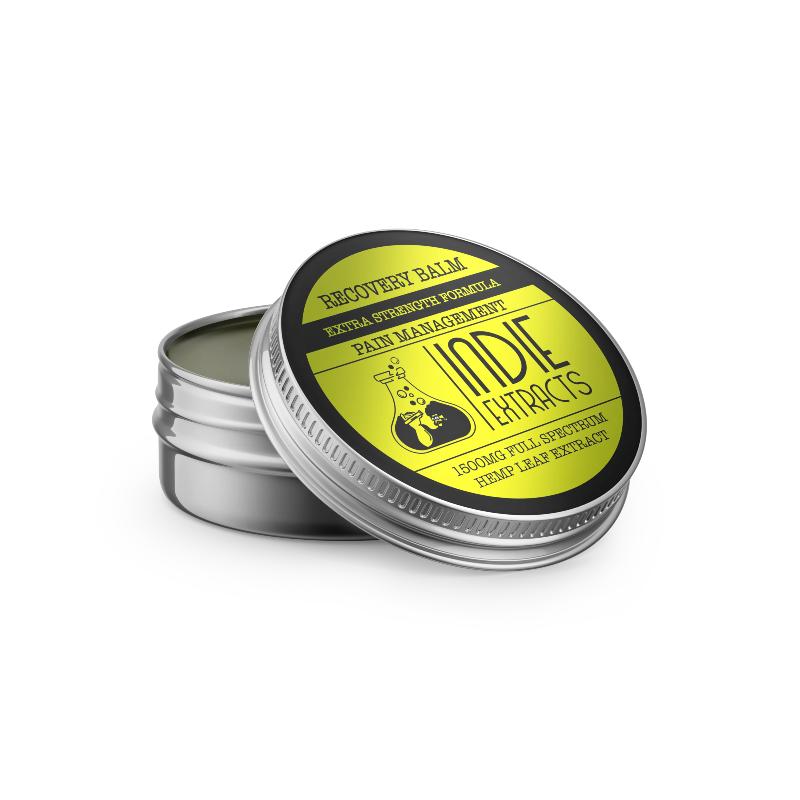 Open tin container of Indie Extracts CBD balm with a yellow and black label.