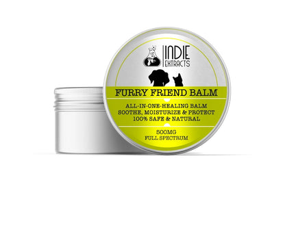 A silver tin container with a partially open lid labeled "Furry Friend Balm" by Indie Extracts.