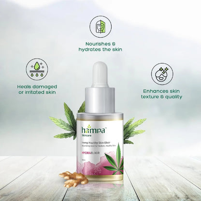 Hampa skincare dropper bottle with cannabis leaves on a light wooden surface