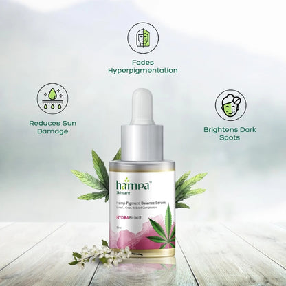 Hampa Hemp skincare serum bottle with green leaves on a light gray background
