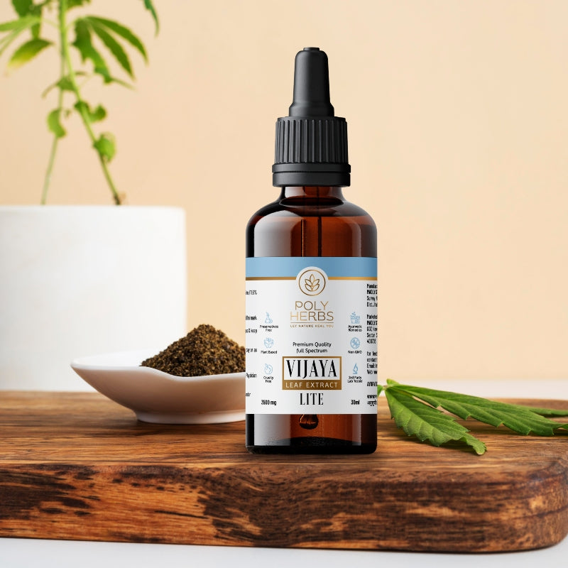 Bottle of Poly Herbs Vijaya Leaf Extract on a wooden surface with a plant in the background
