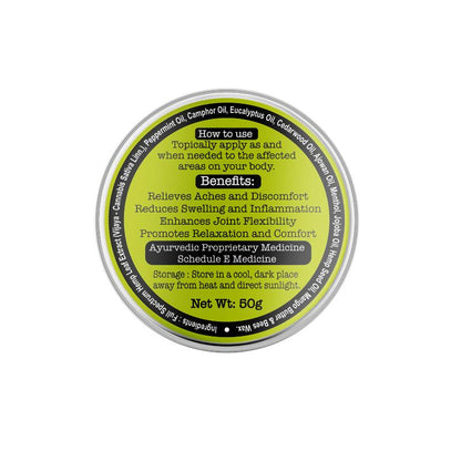  Top view of a circular balm container with a metallic lid and gradient yellow-green label.