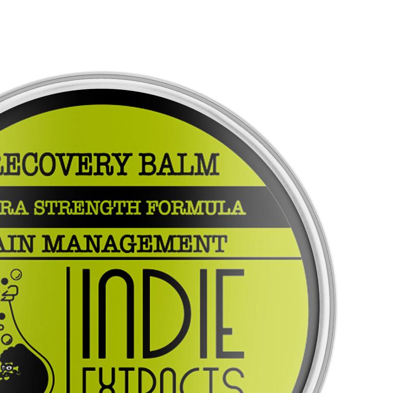 Top view of a circular container of "Indie Extracts" CBD balm with a lime green lid and black text.