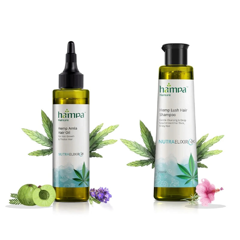 Two bottles of hampa Hemp hair care products with leaves and flowers on a white background