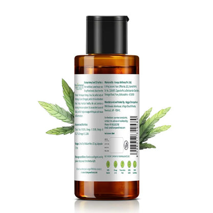 Brown bottle with a label and green leaves on a white background