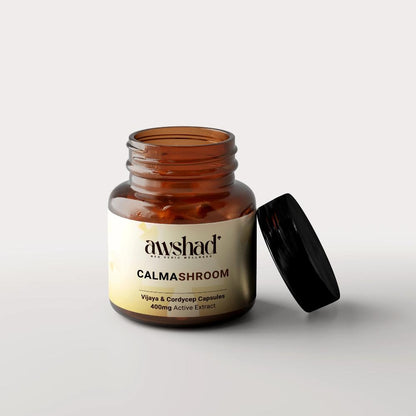 a jar of calmashroom vijaya extract and cordiceps pills sitting on top of a table