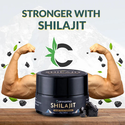 Container of Cannarma Shilajit with flexing muscular arms, black fragments, and green leaves around.