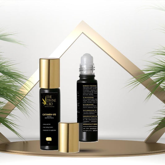 Two black and gold cylindrical CBD product bottles on a golden platform, one with a cap off showing a roll-on applicator.