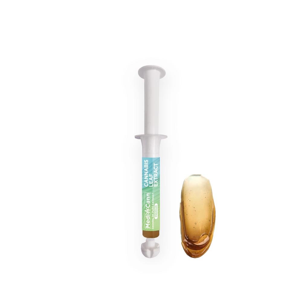 Syringe labeled "Cannabis Leaf Extract" and amber-colored liquid.