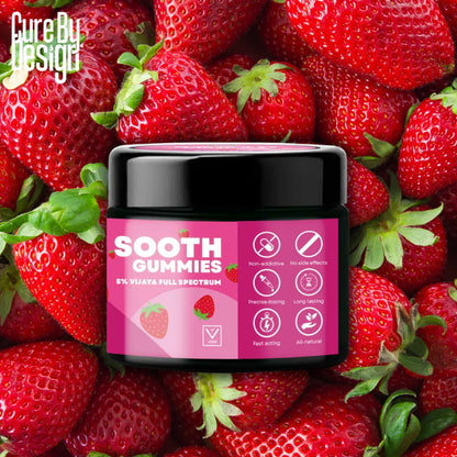 Jar of 'Sooth Gummies' surrounded by strawberries with 'Cure By Design' branding.