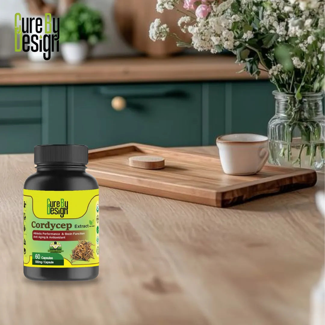 Cure by Design Cordyceps supplement bottle on a wooden table with a cup and flowers in the background.