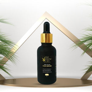 Black serum bottle with a gold cap and a dropper. 
