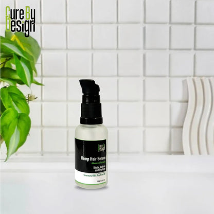 Bottle of Hemp Hair Serum on a bathroom counter with a tiled wall and plant in the background.