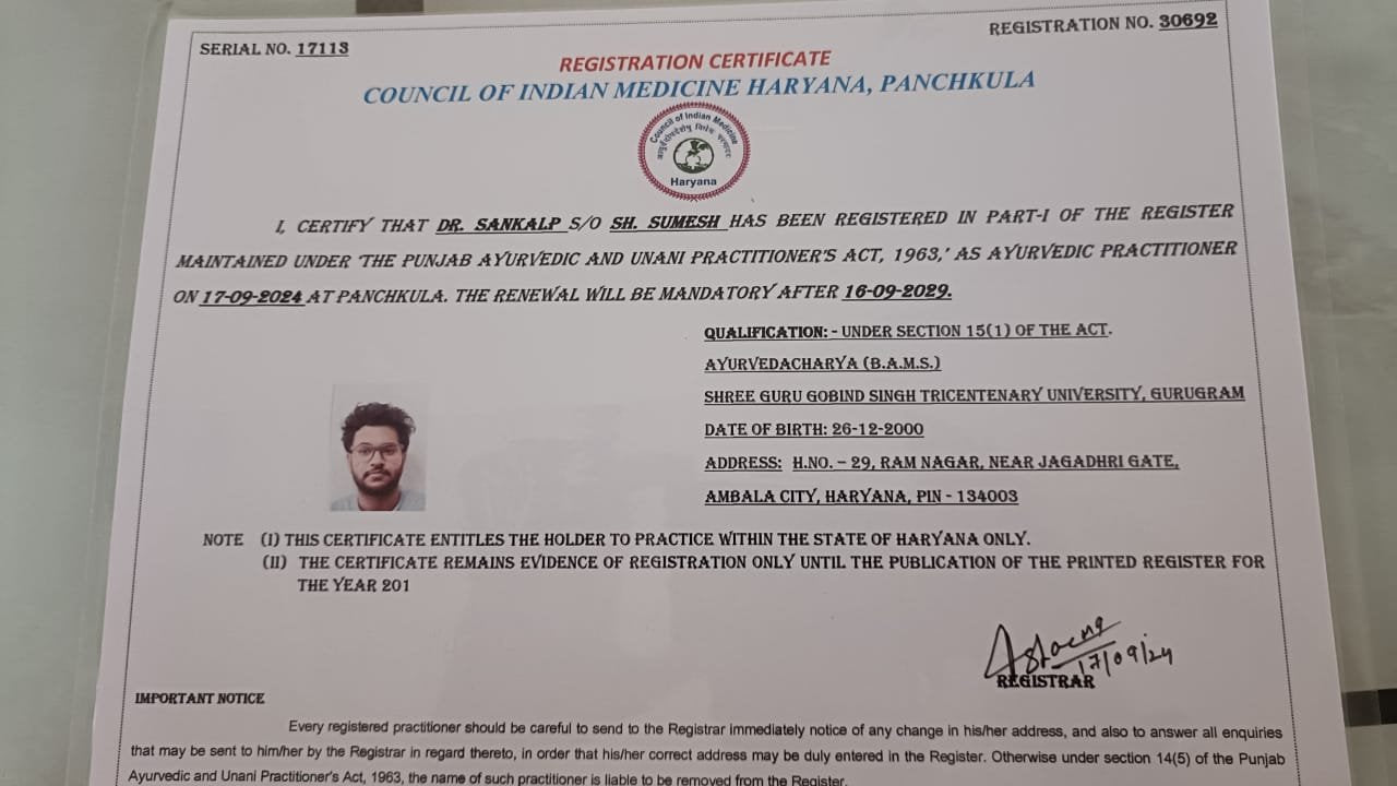 Registration certificate from the Council of Indian Medicine Haryana with a small photo on the left.

