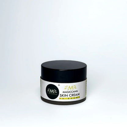 A jar of skin cream with a black lid and a white label, displaying the text "MAGICCANN HEMP SKIN CREAM 30 GRAMS."
