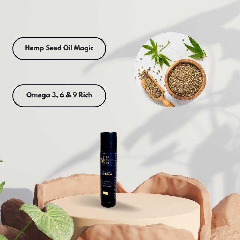Hemp seed oil product display with a dark blue lip balm tube and text stating "Hemp Seed Oil Magic" and "Omega 3, 6 & 9 Rich," alongside an image of hemp seeds and leaves.

