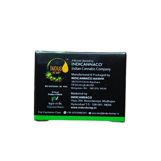 Black packaging with green text and branding for Indicannaco, an Indian cannabis company.