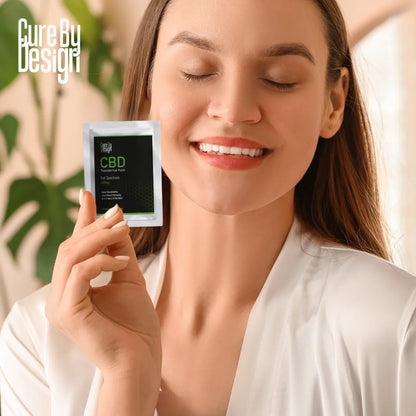 Woman holding a CBD product packaging with a blurred background