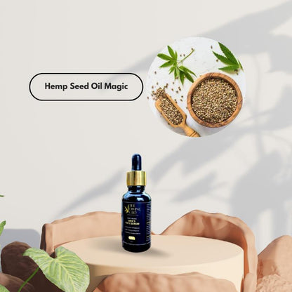 Bottle of hemp seed oil face serum on a beige platform with a circular inset of hemp seeds and hemp leaves; text reads "Hemp Seed Oil Magic."

