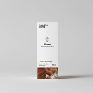 Rectangular white packaging for Karm Improved Focus CBD Oil with coffee flavor, by MONK'S HEMP.