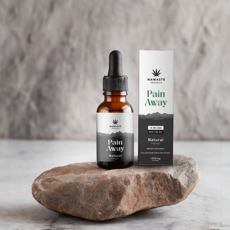 Namaste Naturals Pain Away Full spectrum CBD Oil  product on a stone surface with a neutral background