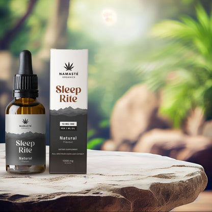 Namaste Organics Sleep Rite Full spectrum CBD Oil bottle and packaging on a wooden surface with a natural background.