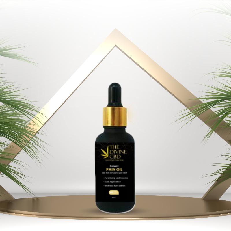 A dropper bottle of Paarmi Cares pain oil with a geometric gold and white triangle background and green leafy plants on both sides.