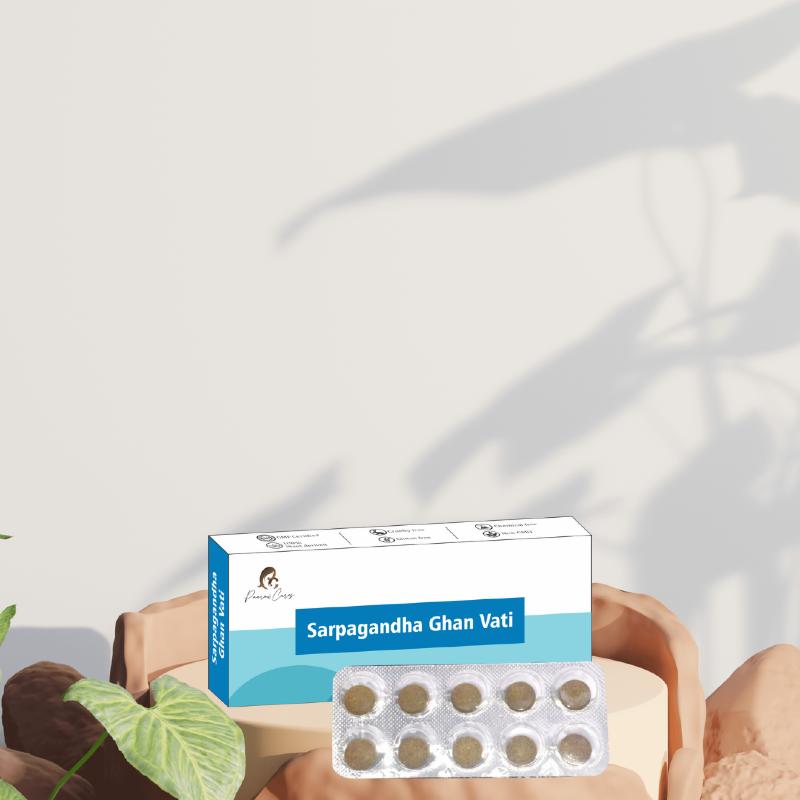  Medicine box of Paarmi Cares Sarpagandha Ghan Vati with blister pack of pills and green leaves.